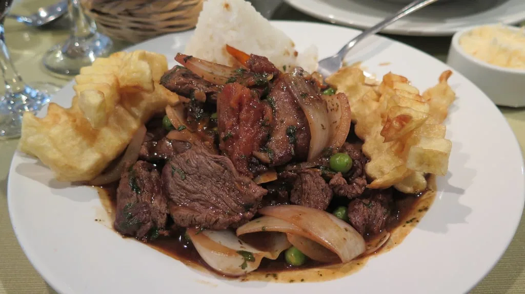 beef cut into pieces with sauteed onions