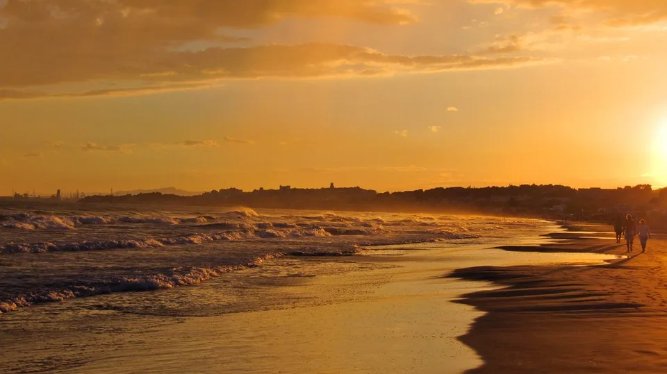 A quiet beach near a historic town in Tarragona province
