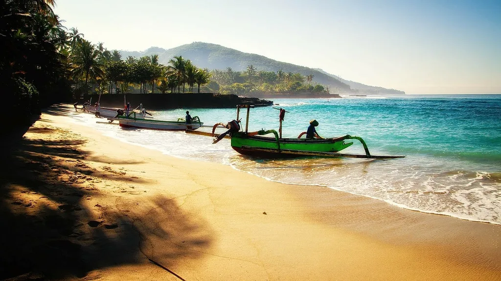 Soft sand and palm trees in Bali beach