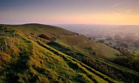 Hambledon Hill, Dorset, UK, in late afternoon sunlight.