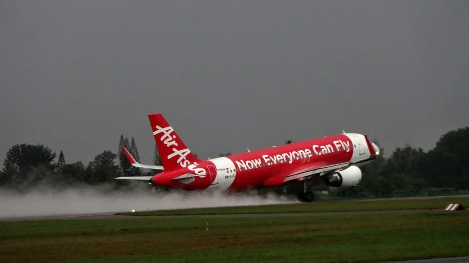 An AirAsia Aeroplane Taking Off the Runway