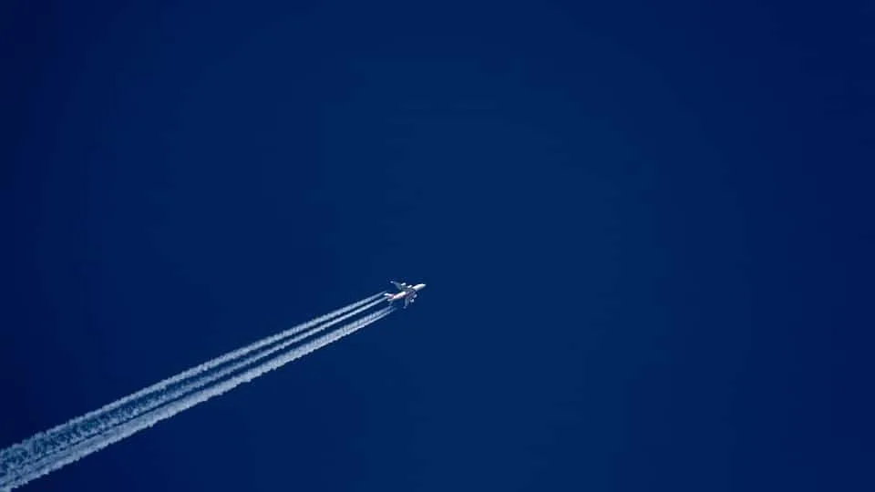 Plane Flying Overhead in Clear Blue Sky