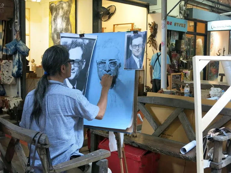 Artist working on the late King’s portrait