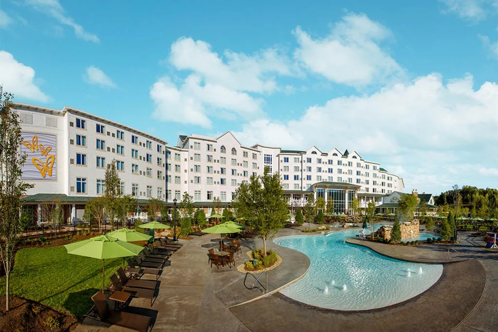 An exterior view of the DreamMore Resort and its swimming pool.