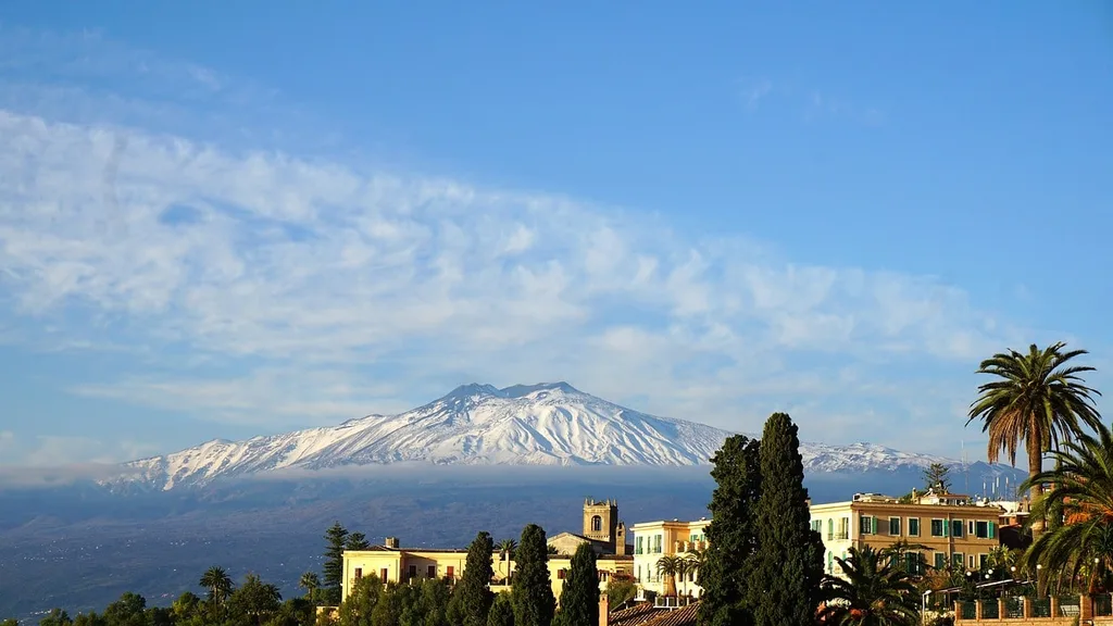 View of Mount Etna from the rooftops of Taormina