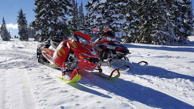 Two snowmobiles on mountain in Colorado